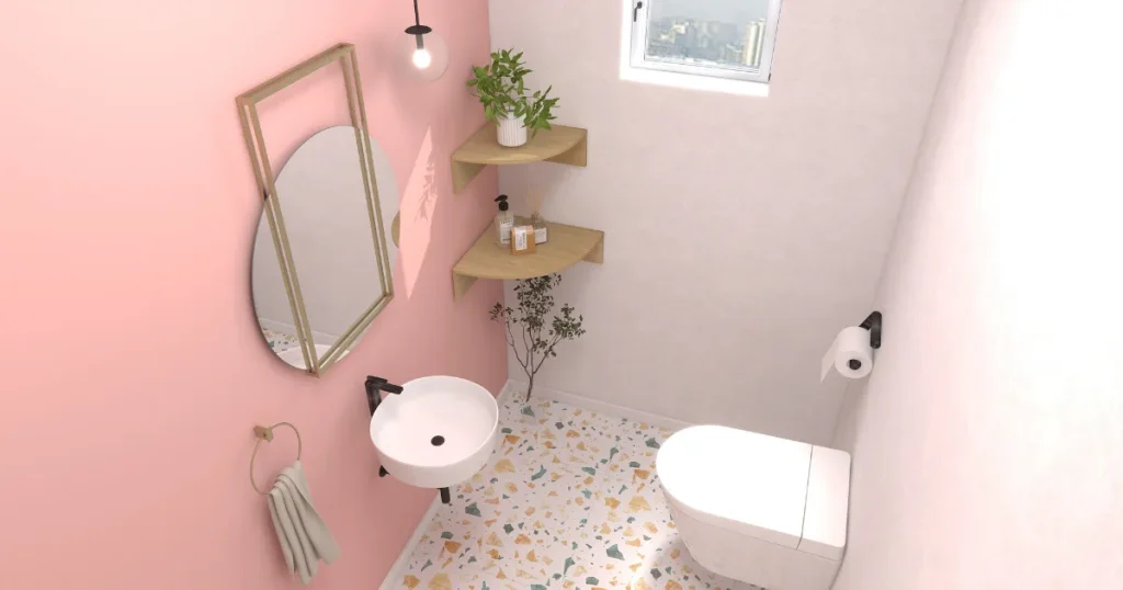 ピンクの壁紙を使った明るいおしやれなトイレ
